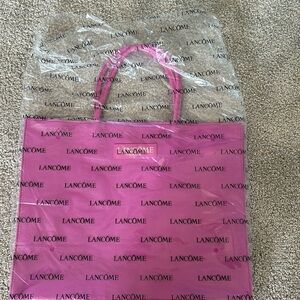 Fabric covered Lancôme tote never used